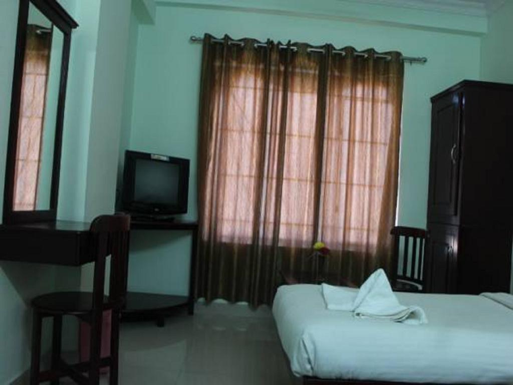 Sm Regency Kochi Værelse billede
